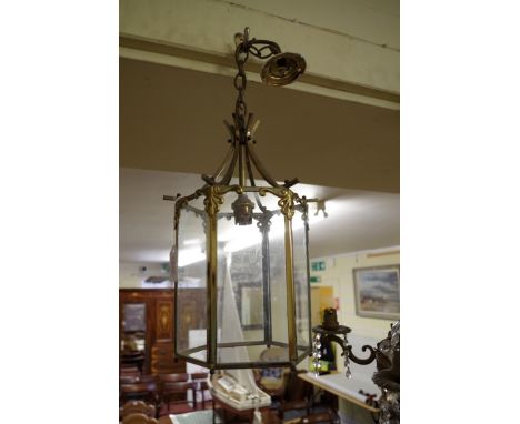 A glass and brass hexagonal hall lantern,&nbsp;32cm high.&nbsp; 