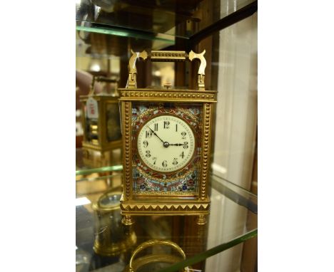 A good brass and champleve enamel carriage clock,&nbsp;with push button repeat, striking on a gong, height including handle 1