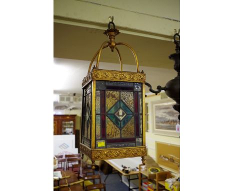 A gilt and stained leaded glass lantern,&nbsp;60cm high. 