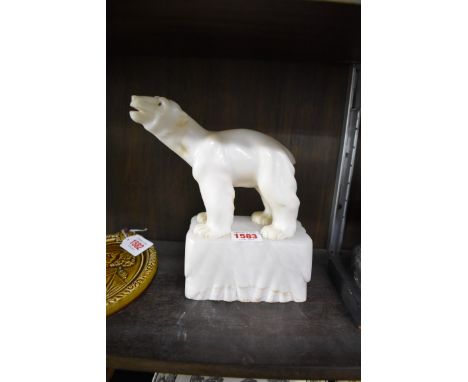 An Art Deco carved&nbsp;alabaster&nbsp;figure of a polar bear on iceberg,&nbsp;21cm high. 