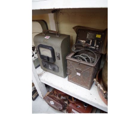 A military short range signalling lamp; together with a Plessey voltmeter. 