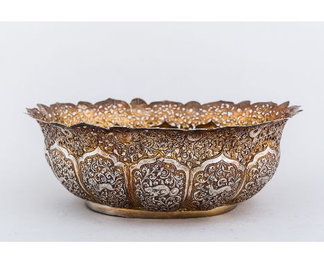 An Indian silver gilt oval basin, probably late 19th Century, pierced, chased and embossed decoration with a lobed lower sect
