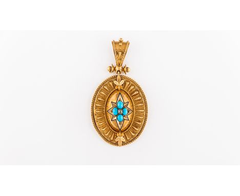 A Victorian yellow metal oval pendant, 45mm x 35mm with domed centre displaying a eight ray star bordered with blue enamel an