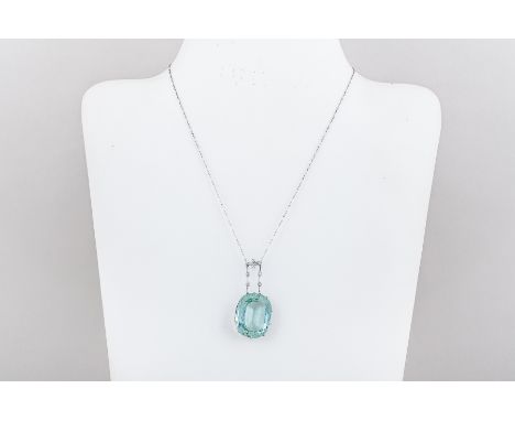 A large aquamarine pendant claw set in a white metal mount with open heart motifs to the cage setting, suspended from a fine 