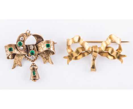 Two brooches. A plain yellow metal frost gilded bow brooch with pendant loop to take a fob, 40mm wide. Approximate weight 9gm