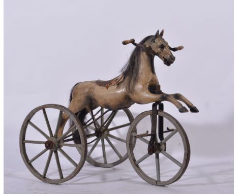 A French painted wood hobby horse tricycle, chain driven, horse grey with horse hair mane and tail, 75cm.