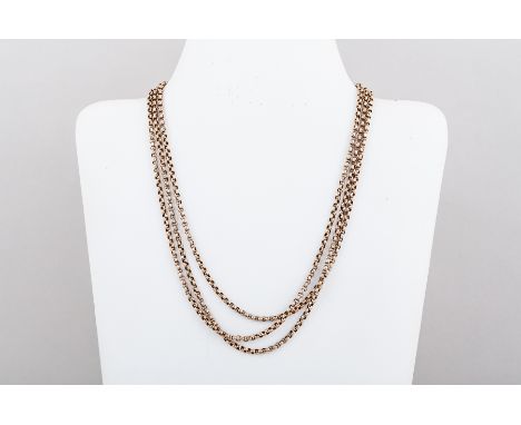 A yellow metal guard/muff chain of circular faceted 3.3mm belcher links. Overall length 146 cm and fitted with a bolt ring fa