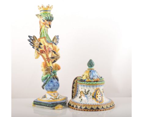 A pair of Italian Maiolica armorial candlesticks, Cantagalli 20th Century, each modelled as a crowned griffen like grotesque 
