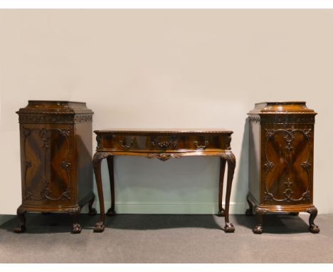 Mahogany dining suite, in the Chippendale style, comprising wind-out table, oval top with carved gadrooned edge, plain frieze