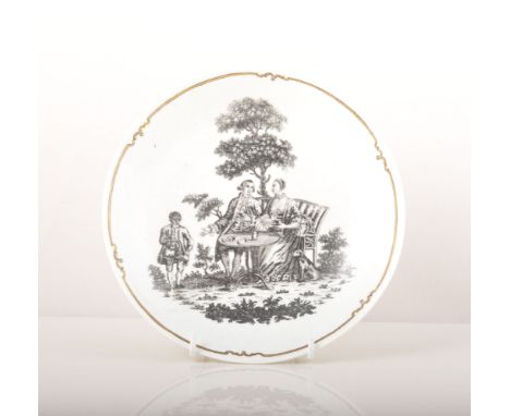 A First Period Worcester printed saucer dish, The Tea Party, after a design by Robert Hancock, circa 1770, gilt banded, diame