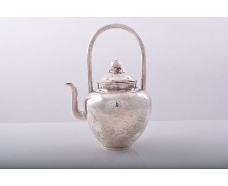 A small Chinese silver teapot, perhaps late 19th Century, shouldered form with engraved characters, fruit finial, plain loop 