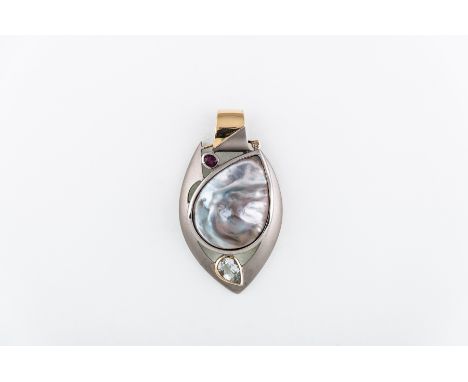 A hallmarked silver pendant, with a tear shaped drop mother of pearl with a blister pearl within the shell set in a frosted m