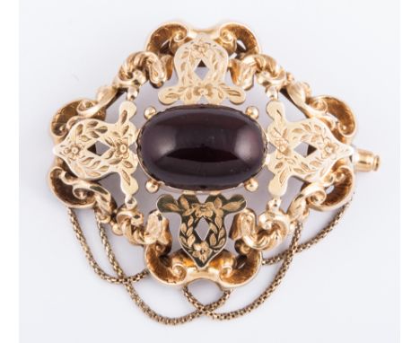A Victorian yellow metal cast brooch, with oval cabochon cut garnet to centre, claw set with a closed back setting. Four engr