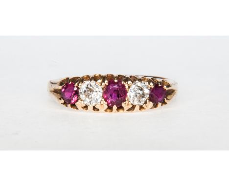 A traditional ruby and diamond half hoop ring, claw set with rubies (2) and diamonds (3), old brilliant cut stones in a plain