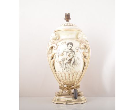A pair of Wedgwood Creamware urn shape lamp bases, ovoid form, with three serephine head scrolled handles, printed with cheru