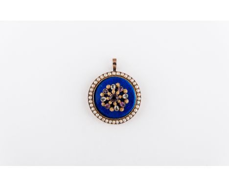 A yellow metal circular pendant, 33mm diameter, decorated with blue guilloche enamel and having an applied raised centre of g