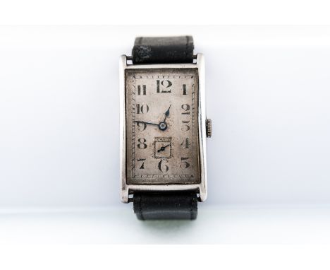 Vintage - A gentleman's silver wrist watch having a rectangular arabic numeral dial with square subsidiary seconds dial. The 