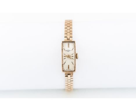 Rotary - A lady's 9 carat yellow gold wrist watch having a rectangular cream baton dial with fine milled edge to longest side