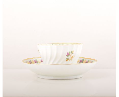 A Barr, Flight & Barr Worcester tea bowl and saucer, circa 1800, wrythen moulded, with dispersed sprigs and a floral band, in