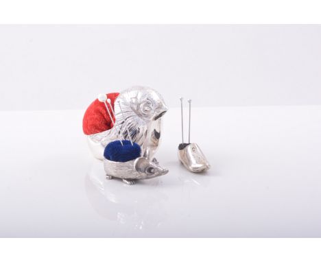 A Victorian style silver novelty pin cushion, designed as a chick, modern, 4cms and two miniature novelty pin cushions, desig