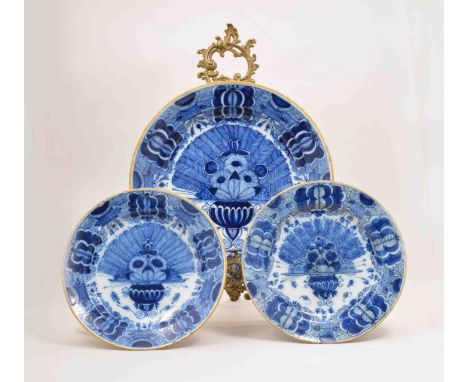 A Dutch Delft blue and white circular shallow dish, probably Three Bells Factory, first half of the 18th Century, peacock pat