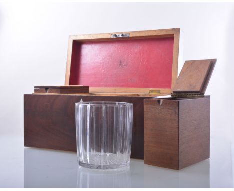 A Victorian mahogany oblong-shaped tea caddy, boxwood outlines, the interior with two hinged compartments and a matched mixin