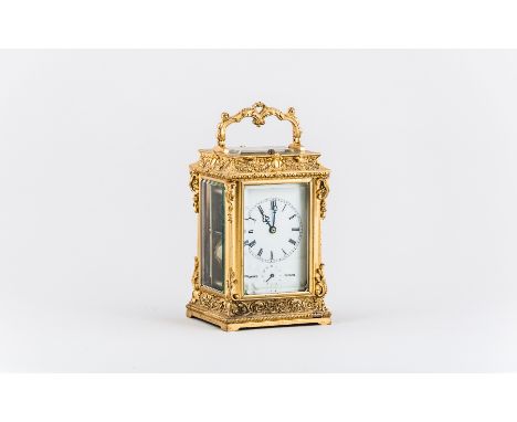 A French Transitional style gilt metal repeating carriage clock, ivorine dial signed Moser a Paris, hour repeating, platform 