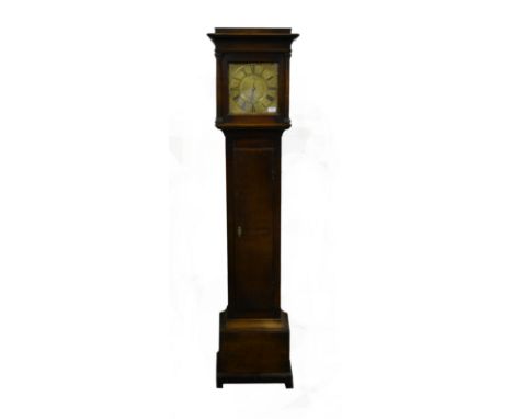 Oak Longcase clock, the hood with a cavetto moulded cornice, three quarter turned columns, long door, bracket feet, 10 inch s