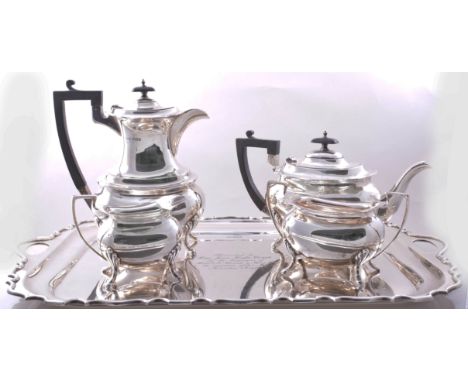 A four piece silver tea set, by Walker & Hall, Sheffield 1935, plain oval form with serpentine outlines, comprising a teapot 