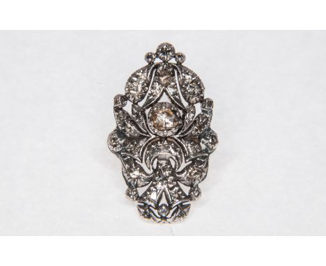 A Georgian yellow and white metal oval diamond cluster ring, set with old rose cut diamonds in a closed back mount on a 2.5mm