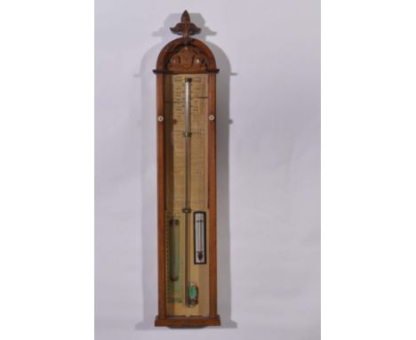 A Victorian Admiral Fitzroy's barometer, arched top with foliate scroll surmount, printed paper chart, 112cms.