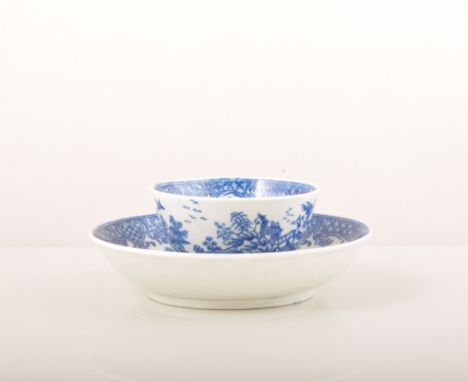 A First Period Worcester blue and white tea bowl and saucer, printed The Argument, circa 1780, hatched crescent marks, (2).