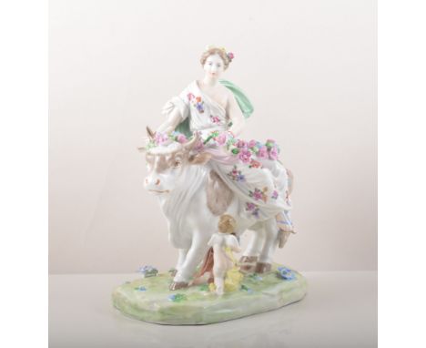 A Dresden porcelain group, Europa and the Bull, modern figure with billowing cloak and rose festoons, attended by cherub, 26c