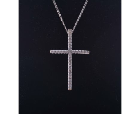 A diamond set hallmarked 18 carat white gold cross, 36mm x 24mm, set with diamonds (32), brilliant cut stones. The cross bein