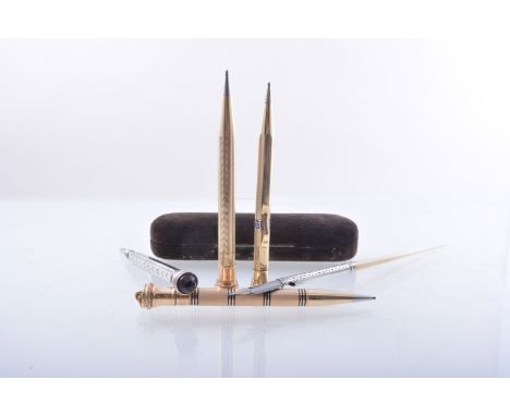 An American gilt metal propelling pencil, Wahl Ever Sharp, engine turned, 10cms, gilt metal pencil holder, five other propell
