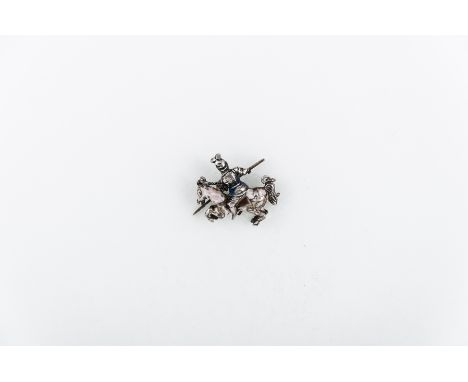 A white metal and enamel jousting knight on horseback pendant collet set with an old rose cut diamond. Overall dimensions 28m