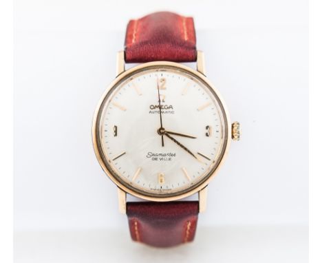 Omega  - A gentleman's  Automatic Seamaster De Ville wrist watch in a 9 carat yellow gold case having a circular cream baton 