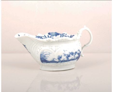 A First Period Worcester blue and white cream-boat, The Two-Porter Landscape, circa 1770, press moulded, crescent mark, lengt