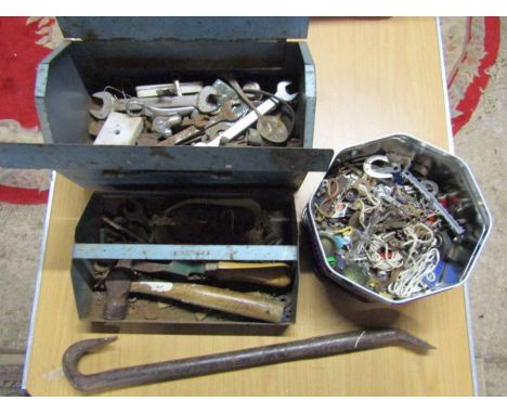 Metal toolbox with tools including hammer, spanners and crowbar, and tin of oddments 