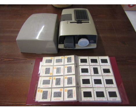 vintage Aldis projector (for display) and a folder of slides