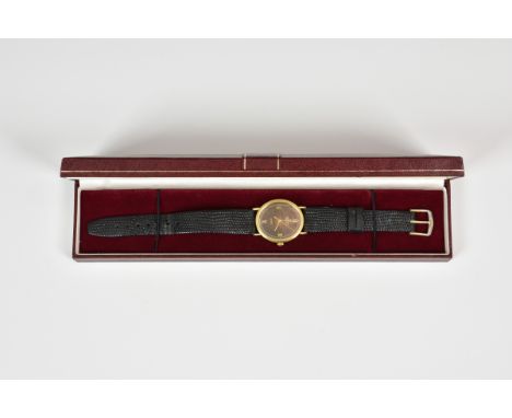 A Marvin Revue 9ct gold gents quartz watch, the signed, oval 28 x 24mm. bronze dial with gilt Roman numerals at the quarters,