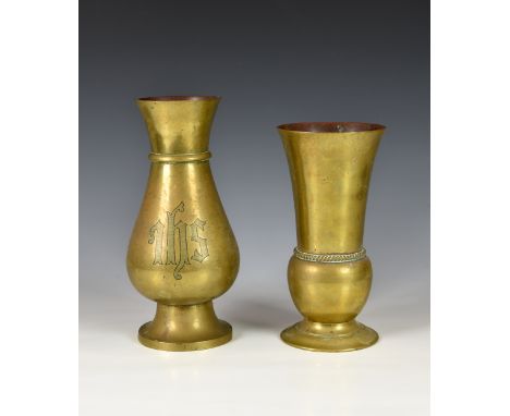 Two antique polished bronze vases each of shaped form, one inscribed with initials 'IHS', the largest measuring 10 ½in. (26.8