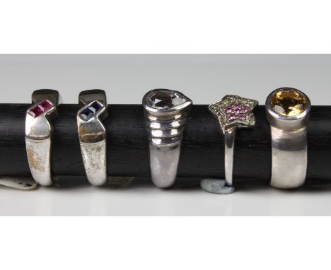A collection of five silver rings set with various gemstones comprising citrine; diamond &amp; pink sapphire; Aquamarine; blu