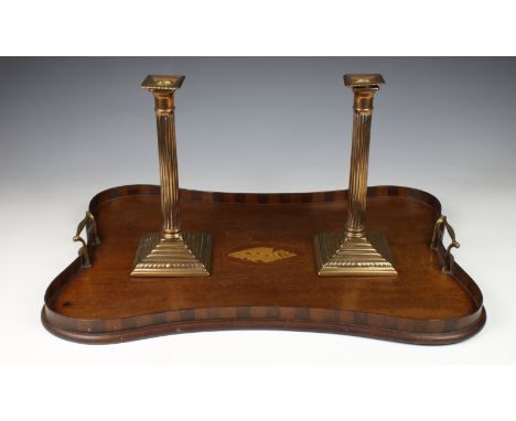 An Edwardian mahogany inlaid tray English circa 1900, of shaped form with twin brass carrying handles, raised gallery and cen