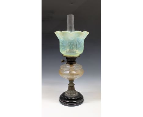 A Victorian oil lamp with vaseline glass shade the floral decorated shade a/f (cracked), the lamp with cut glass reservoir an
