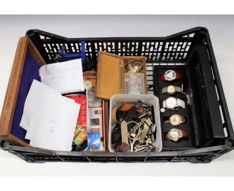 A collection of watchmaker's tools spare straps, batteries, watch copies etc.
