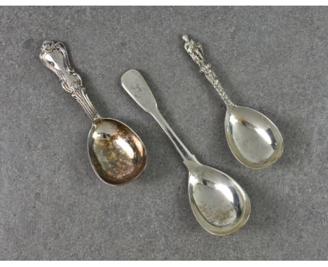 Three silver caddy spoons to include a George III fiddle pattern spoon by John &amp; Henry Lias, London 1818, inscribed initi