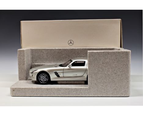 A boxed Mercedes-Benz 1-18 scale AMG SLS model.