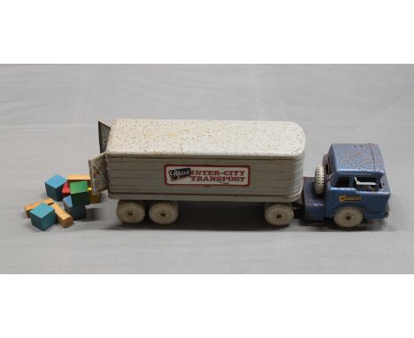 A Louis Marx &amp; Co Inter-City Transport lorry the cab in blue, trailer grey, overall length 27¾in. (70.5cm.) long, playwor