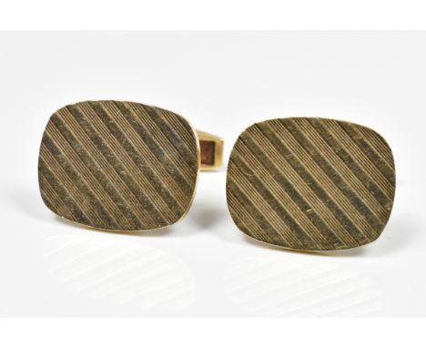 A pair of 9ct yellow gold cufflinks of oval form with engine turned decoration, 10g.